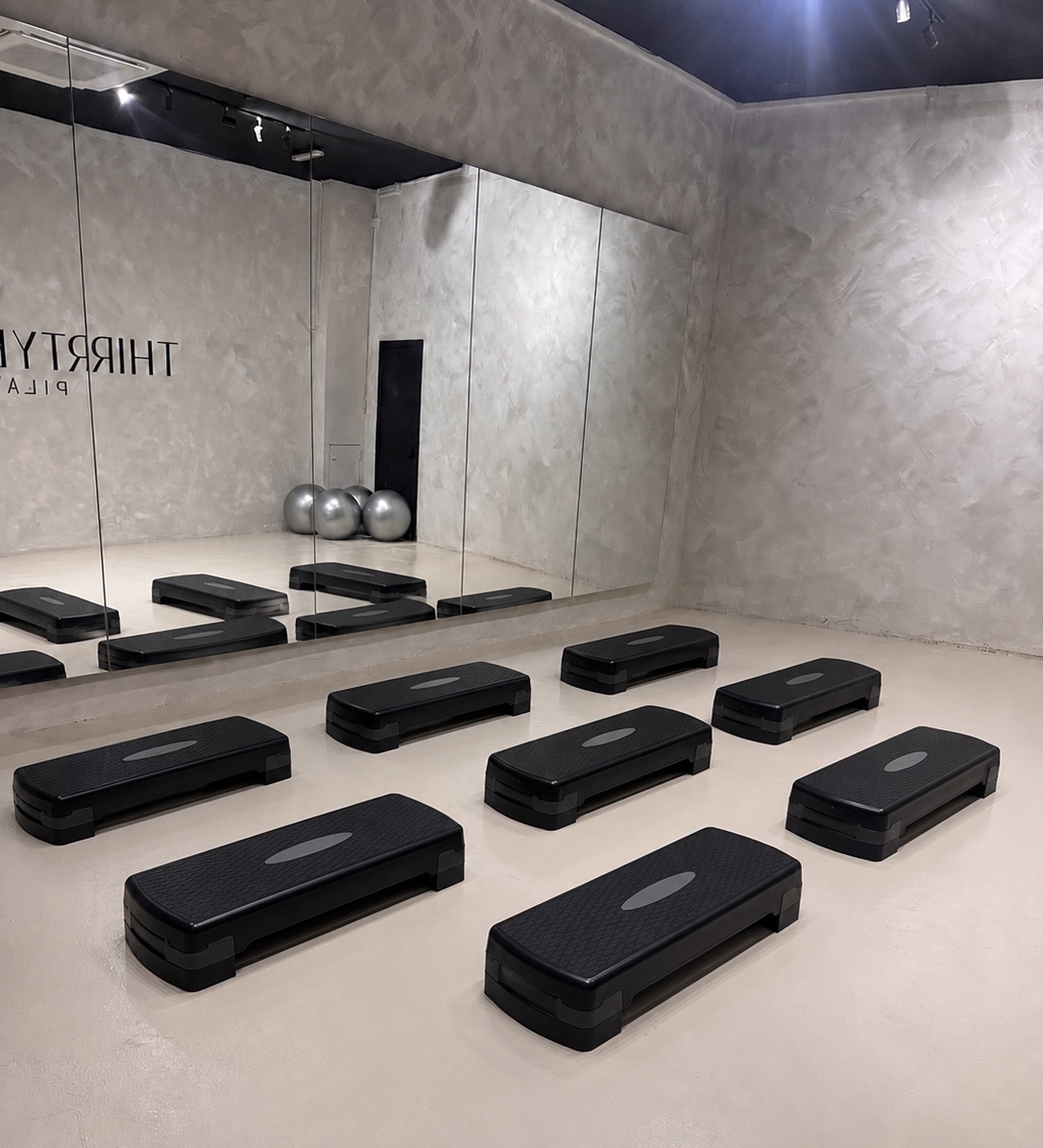 Step platforms set up in studio, ready for class