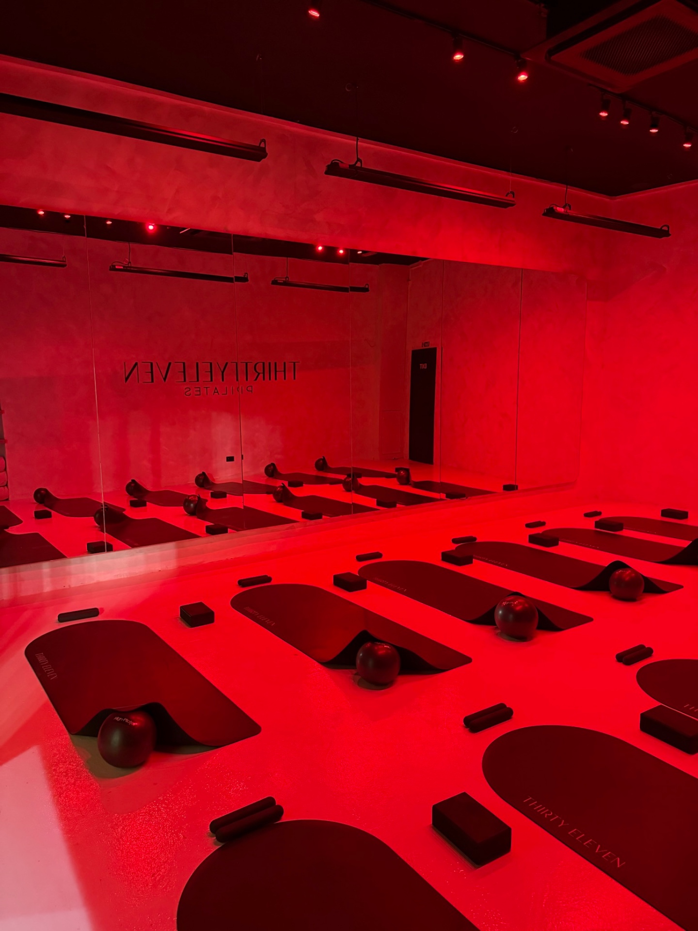 Heated infrared studio, mat class, warm light