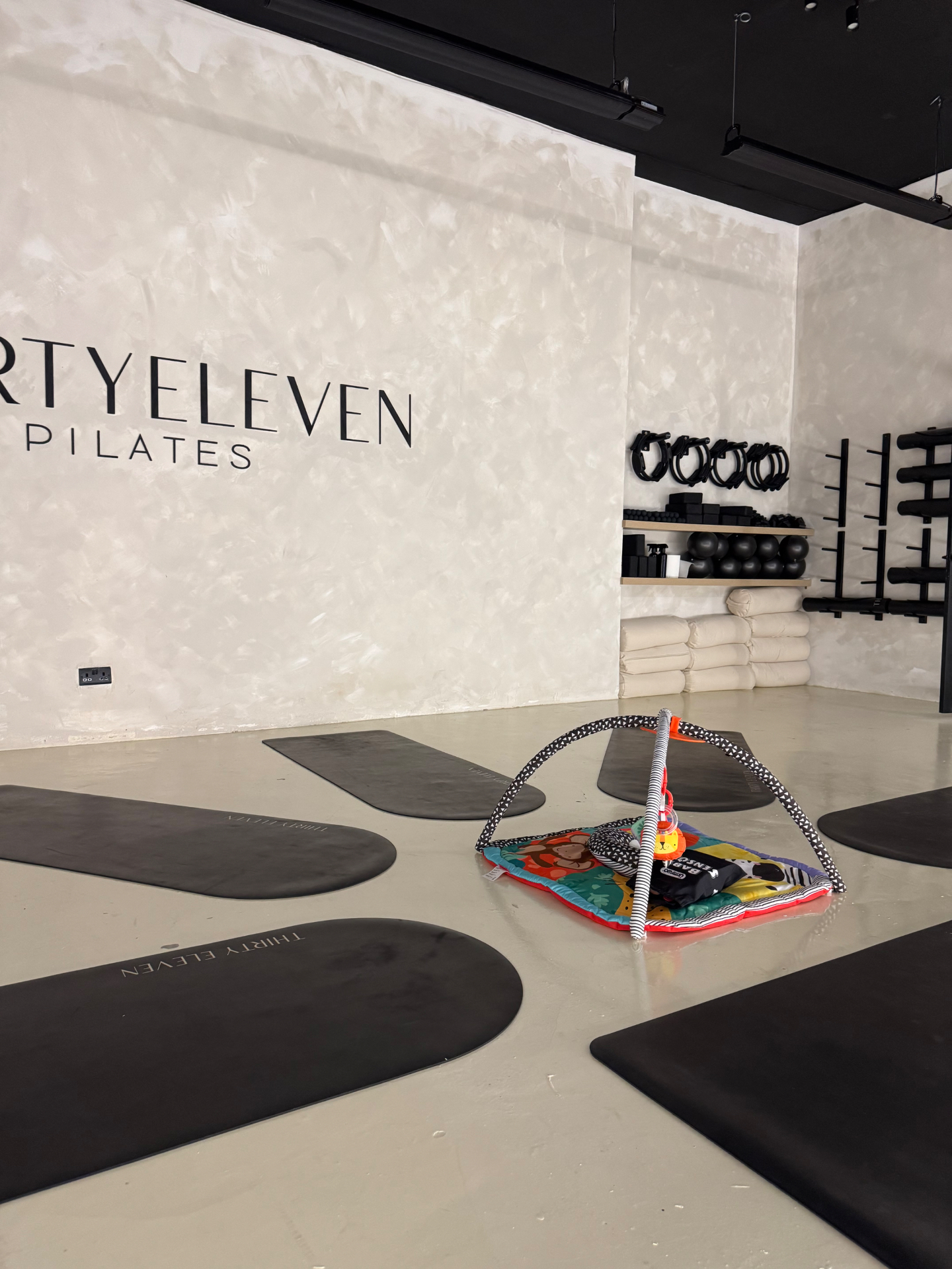 New mums in a gentle mat class with babies